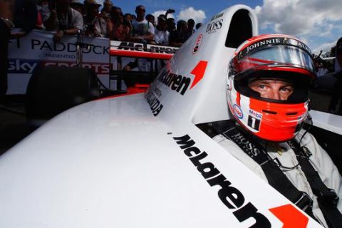CHICHESTER, ENGLAND - JUNE 27:  McLaren Formula One driver and 2009 World champion Jenson Button prepares to drive the ex Ayrton Senna McLaren MP4 up the hill at Goodwood on June 27, 2015 in Chichester, England.  (Photo by Charles Coates/Getty Images)