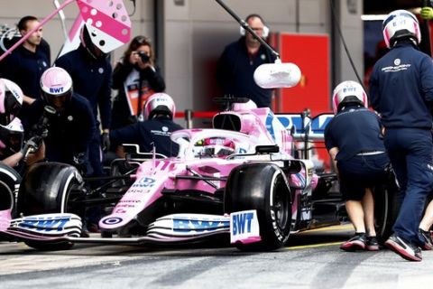 Pit crew work on the car of Racing Point driver Sergio Perez of Mexico during the Formula One pre-season testing session at the Barcelona Catalunya racetrack in Montmelo, outside Barcelona, Spain, Friday, Feb. 28, 2020. (AP Photo/Joan Monfort)