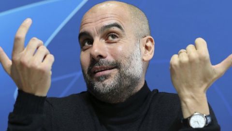 Manchester City manager Pep Guardiola speaks during a press conference at the City Football Academy, Manchester, England, Tuesday Dec. 11, 2018. Manchester City will play Hoffenheim in a Champions League soccer match on Wednesday. (Martin Rickett/PA via AP)