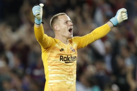 Barcelona's goalkeeper Marc-Andre ter Stegen celebrates Luis Suarez second goal during a group F Champions League soccer match between F.C. Barcelona and Inter Milan at the Camp Nou stadium in Barcelona, Spain, Wednesday, Oct. 2, 2019. (AP Photo/Joan Monfort)