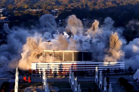 The Georgia Dome is destroyed in a scheduled implosion Monday, Nov. 20, 2017, in Atlanta. The Dome was the home of the Atlanta Falcons, hosted two Super Bowls and the 1996 Summer Olympic Games among other sporting events. (AP Photo/John Bazemore)