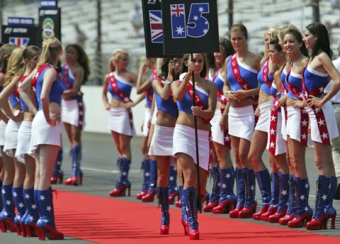 Grid girls in star spangled American outfits line up just before the United States Grand Prix auto race at the Indianapolis Motor Speedway in Indianapolis, Sunday, June 17, 2007.   (AP Photo/AJ Mast)