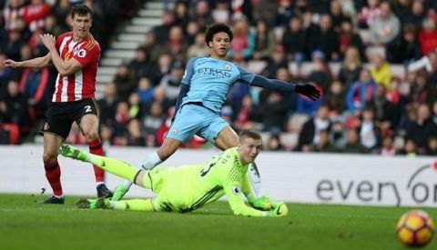 Manchester City's German midfielder Leroy Sane (C) scores their second goal past Sunderland's English goalkeeper Jordan Pickford (R) during the English Premier League football match between Sunderland and Manchester City at the Stadium of Light in Sunderland, north-east England on March 5, 2017. / AFP PHOTO / SCOTT HEPPELL / RESTRICTED TO EDITORIAL USE. No use with unauthorized audio, video, data, fixture lists, club/league logos or 'live' services. Online in-match use limited to 75 images, no video emulation. No use in betting, games or single club/league/player publications.  /         (Photo credit should read SCOTT HEPPELL/AFP/Getty Images)