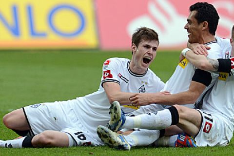 Moenchengladbach's Venezuelan midfielder Juan Arango (C) celebrates scoring with his teammates Norwegian midfielder Havard Nordtveit (L) and midfielder Marco Reus during the German first division Bundesliga football match Borussia Moenchengladbach vs 1. FC Cologne in the German city of Moenchengladbach on April 15, 2012. AFP PHOTO / PATRIK STOLLARZ

+++ RESTRICTIONS / EMBARGO - DFL LIMITS THE USE OF IMAGES ON THE INTERNET TO 15 PICTURES (NO VIDEO-LIKE SEQUENCES) DURING THE MATCH AND PROHIBITS MOBILE (MMS) USE DURING AND FOR FURTHER TWO HOURS AFTER THE MATCH. FOR MORE INFORMATION CONTACT DFL. (Photo credit should read PATRIK STOLLARZ/AFP/Getty Images)