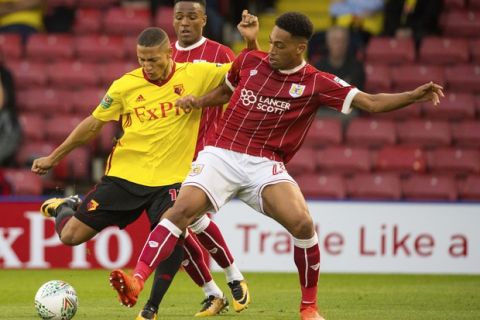 Watford's Richarlison, left, and Bristol City's Zak Vyner battle for the ball during the League Cup second round soccer match at Vicarage Road, Watford, England, Tuesday Aug. 22, 2017. (Dominic Lipinski/PA via AP)