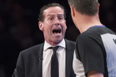 Brooklyn Nets head coach Kenny Atkinson argues with referee David Guthrie (16) during the first half of Game 4 of a first-round NBA basketball playoff series, Saturday, April 20, 2019, in New York. (AP Photo/Mary Altaffer)