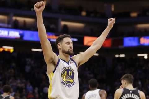Golden State Warriors guard Klay Thompson celebrates during the closing moments of the Warriors 130-125 win over the Sacramento Kings in an NBA basketball game Friday, Dec. 14, 2018, in Sacramento, Calif. (AP Photo/Rich Pedroncelli)