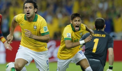 Brazil's Fred, left, and Neymar celebrate after Fred scored the opening goal during the soccer Confederations Cup final between Brazil and Spain at the Maracana stadium in Rio de Janeiro, Brazil, Sunday, June 30, 2013. (AP Photo/Victor R. Caivano)
