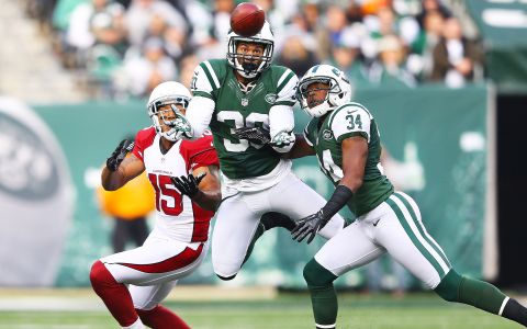 EAST RUTHERFORD, NJ - DECEMBER 02:  LaRon Landry #30 of the New York Jets intercepts a pass thrown by  Ryan Lindley #14 of the Arizona Cardinals during their game at at MetLife Stadium on December 2, 2012 in East Rutherford, New Jersey.  (Photo by Al Bello/Getty Images)
