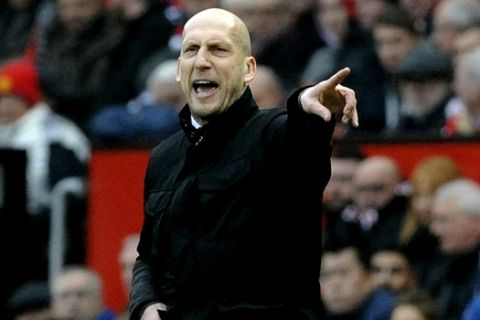 FILE - In this file photo dated Saturday, Jan. 7, 2017, Reading's manager Jaap Stam, gestures to his team from the sidelines during the English FA Cup Third Round match against Manchester United at Old Trafford in Manchester, England.  It is announced Wednesday March 6, 2019, that Stam has been appointed head coach of Dutch soccer team Feyenoord starting next season. (AP Photo/Rui Vieira, FILE)