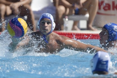 Georgios Dervisis of Greece, left, challenges with  Milan Aleksic of Serbia during the men's water polo Greece vs. Serbia bronze match of the Swimming World Championships in  Budapest, Hungary, Saturday, July 29, 2017. (Balazs Czagany/MTI via AP)