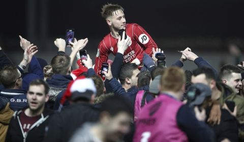Bristol City's Josh Brownhill celebrates their victory as he is lifted up by fans after the final whistle in the English League Cup Quarter Final soccer match between Bristol City and Manchester United at Ashton Gate, Bristol, England, Wednesday, Dec. 20, 2017. Bristol City defeated Manchester United 2-1. (Nick Potts/PA via AP)