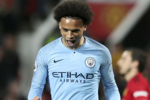 CORRECTS ID OF PLAYER   Manchester City's Leroy Sane celebrates after scoring his side's second goal during the English Premier League soccer match between Manchester United and Manchester City at Old Trafford Stadium in Manchester, England, Wednesday April 24, 2019. (AP Photo/Jon Super)