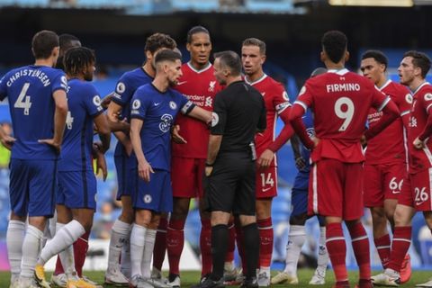 Chelsea players, left, talk with the referee during the English Premier League soccer match between Chelsea and Liverpool at Stamford Bridge Stadium, Sunday, Sept. 20, 2020. (Will Oliver/Pool via AP)