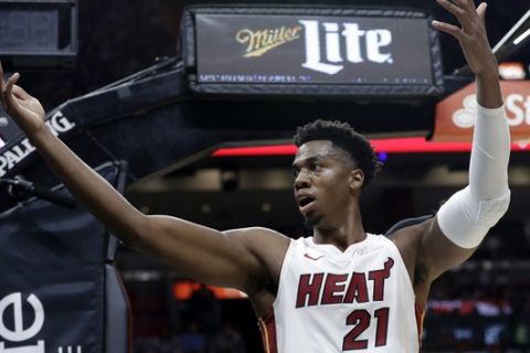Miami Heat center Hassan Whiteside encourages the crowd during the second half of an NBA basketball game against the New York Knicks, Wednesday, Oct. 24, 2018, in Miami. The Heat won 110-87. (AP Photo/Lynne Sladky)