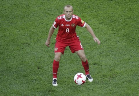 Russia's Denis Glushakov eyes the ball during the Confederations, Cup Group A soccer match between Russia and New Zealand, at the St.Petersburg stadium in St.Petersburg, Russia, Saturday, June 17, 2017. (AP Photo/Dmitri Lovetsky)