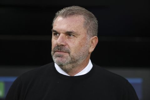 Celtic's head coach Ange Postecoglou looks on before the start of a Champions League group F soccer match between Shakhtar Donetsk and Celtic at Wojska Polskiego stadium, in Warsaw, Poland, Wednesday Sept. 14, 2022. (AP Photo/Michal Dyjuk)