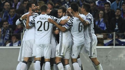 Juventus players celebrate after scoring their second goal during the Champions League round of 16, first leg, soccer match between FC Porto and Juventus at the Dragao stadium in Porto, Portugal, Wednesday, Feb. 22, 2017. (AP Photo/Paulo Duarte)