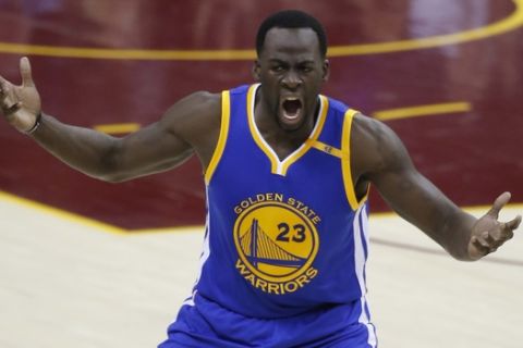 Golden State Warriors forward Draymond Green (23) reacts to a foul against the Cleveland Cavaliers in the first half of Game 4 of basketball's NBA Finals in Cleveland, Friday, June 9, 2017. (AP Photo/Ron Schwane)