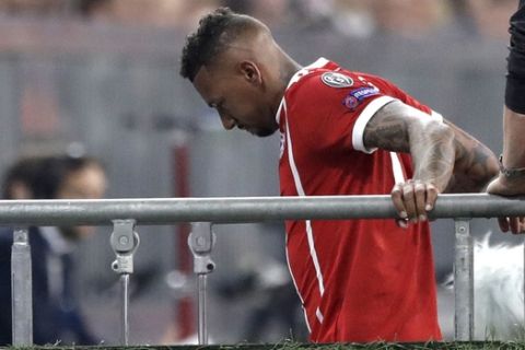 Bayern's Jerome Boateng leaves the pitch after suffering an injury during the semifinal first leg soccer match between FC Bayern Munich and Real Madrid at the Allianz Arena stadium in Munich, Germany, Wednesday, April 25, 2018. (AP Photo/Matthias Schrader)