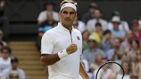Switzerland's Roger Federer celebrates winning a point against Spain's Rafael Nadal during a men's singles semifinal match on day eleven of the Wimbledon Tennis Championships in London, Friday, July 12, 2019. (AP Photo/Ben Curtis)