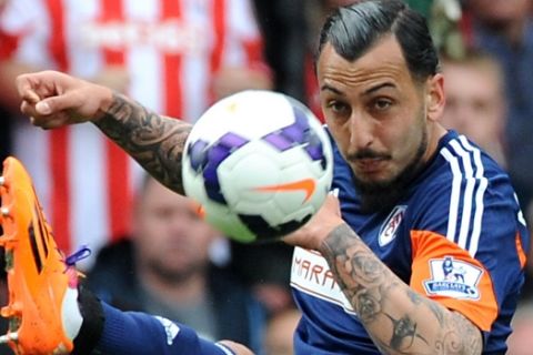 Fulham's Kostas Mitroglou during the English Premier League soccer match between Stoke City and Fulham at the Britannia Stadium in Stoke On Trent, England, Saturday, May 3, 2014. (AP Photo/Rui Vieira)
