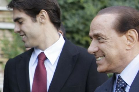 In this picture made available Saturday, Jan. 17, 2009, Italian Premier Silvio Berlusconi, right, and Milan soccer team's Brazilian player Kaka are seen during a meeting with Brazil's President Luiz Inacio Lula da Silva, not seen in photo, in Rome, Tuesday, Nov. 11, 2008., Tuesday, Nov. 11, 2008. AC Milan president and Italian Prime Minister Silvio Berlusconi thinks it will be difficult for Kaka to resist the rich offer from Premier League club Manchester City. City, which is bankrolled by the oil-rich Abu Dhabi United Group, has reportedly offered Milan more than 100 million pounds (US$130 million) for Kaka in a deal that would make the Brazilian playmaker the best-paid player in football. (AP Photo/Andrew Medichini)