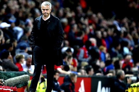 Manchester United manager Jose Mourinho stands on the touchline during the English Premier League soccer match between Manchester United and Tottenham Hotspur at Old Trafford stadium in Manchester, England, Monday, Aug. 27, 2018. (AP Photo/Dave Thompson)
