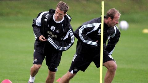 ** RETRANSMISSION ** Micheal Owen left goes head to head with Captain Alan Shearer  during their training session at Newcastle's Training Ground, Longbenton North East England, Friday Sept. 16, 2005. (AP Photo/Scott Heppell)   