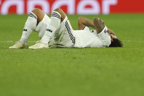 Real's Marcelo injures during the Champions League, group G, soccer match between Real Madrid and Viktoria Plzen at the Santiago Bernabeu stadium in Madrid, Spain, Tuesday Oct. 23, 2018. (AP Photo/Paul White)
