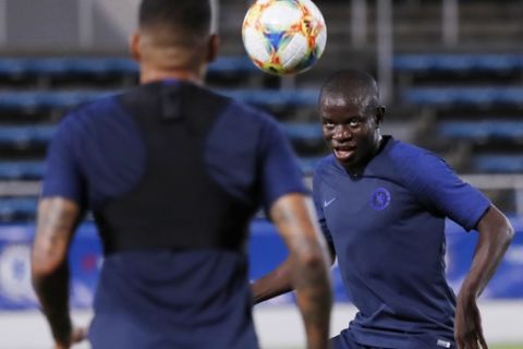 Chelsea's N'Golo Kante, right, exercises with his teammates during a training session prior to a soccer match between Chelsea FC and Kawasaki Frontale in Yokohama Thursday, July 18, 2019. (AP Photo/Eugene Hoshiko)