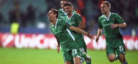 Ludogorets Razgrad's Bulgarian defender Yordan Minev (L) celebrates with teammates after scoring a goal  during the UEFA Champions League Group B football match between Ludogorets Razgrad and Basel at the Vassil Levski stadium in Sofia on October 22, 2014. AFP PHOTO / DIMITAR DILKOFF        (Photo credit should read DIMITAR DILKOFF/AFP/Getty Images)