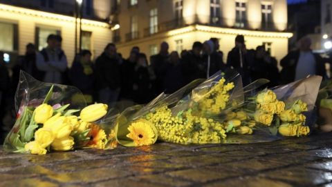 Residents of Nantes, western France, and FC Nantes soccer fans are gathered in the city center lay flowers to pay tribute to FC Nantes soccer player Emiliano Sala of Argentina, Tuesday, Jan. 22, 2019. The French civil aviation authority said Tuesday, Emiliano Sala was aboard a small passenger plane that went missing off the coast of the island of Guernsey. (AP Photo/David Vincent)