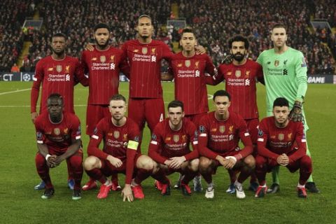 Liverpool team players pose prior to the start of a second leg, round of 16, Champions League soccer match between Liverpool and Atletico Madrid at Anfield stadium in Liverpool, England, Wednesday, March 11, 2020. (AP Photo/Jon Super)