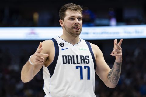 Dallas Mavericks guard Luka Doncic (77) celebrates after a 3-point basket during the first half of an NBA basketball game against the Orlando Magic, Sunday, Oct. 30, 2022, in Dallas. (AP Photo/Brandon Wade)