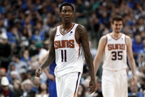 Phoenix Suns guard Jamal Crawford (11) and Dragan Bender (35) walk up court in the second half of an NBA basketball game against the Dallas Mavericks in Dallas, Tuesday, April 9, 2019. (AP Photo/Tony Gutierrez)