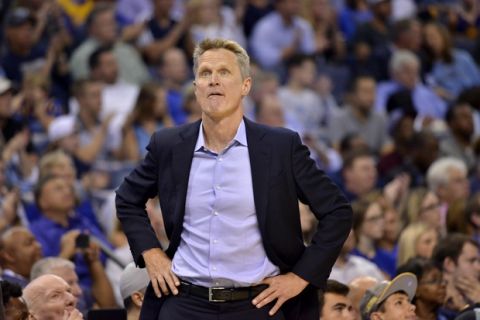 Golden State Warriors head coach Steve Kerr stands on the court in the second half of an NBA basketball game against the Memphis Grizzlies Saturday, Oct. 21, 2017, in Memphis, Tenn. (AP Photo/Brandon Dill)