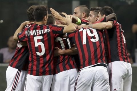 AC Milan's Mateo Musacchio celebrates with teammates after scoring his side's second goal, during the Europa League group D soccer match between AC Milan and Rijeka, at the Milan San Siro Stadium, Italy, Thursday, Sept. 28, 2017. (AP Photo/Luca Bruno)