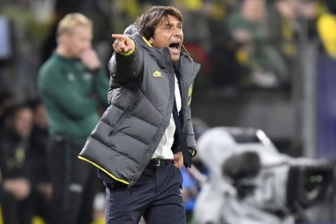 Inter Milan's head coach Antonio Conte gives instructions during the Champions League group F soccer match between Borussia Dortmund and Inter Milan, in Dortmund, Germany, Tuesday, Nov. 5, 2019. (AP Photo/Martin Meissner)