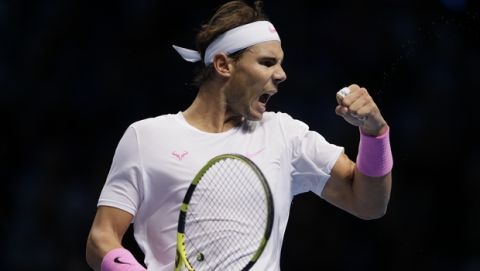Rafael Nadal of Spain reacts after winning a point against Daniil Medvedev of Russia during their ATP World Tour Finals singles tennis match at the O2 Arena in London, Wednesday, Nov. 13, 2019. (AP Photo/Kirsty Wigglesworth)