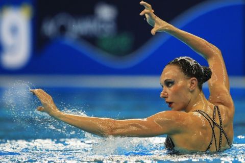 SHANGHAI, CHINA - JULY 20:  Natalia Ischenko of Russia Federation competes in the Synchronized Swimming Solo Free Final during Day Five of the 14th FINA World Championships at the Oriental Sports Center on July 20, 2011 in Shanghai, China.  (Photo by Ezra Shaw/Getty Images)