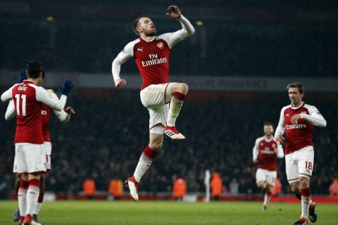 Arsenal's Aaron Ramsey celebrates after scoring his side's third goal of the game during the English Premier League soccer match between Arsenal and Everton at the Emirates stadium in London, Saturday, Feb. 3, 2018. (AP Photo/Alastair Grant)