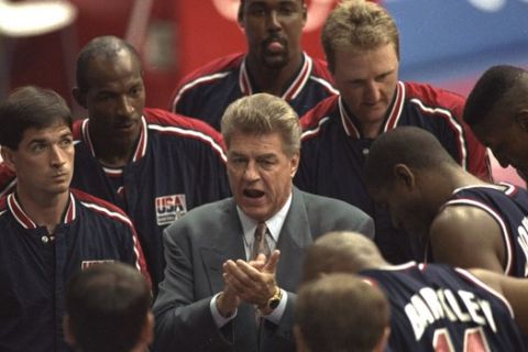 USA basketball coach Chuck Daly talks with the team during their preliminary round basketball game with Croatia at the Summer Olympics in Barcelona Monday, July 27, 1992. (AP Photo/Ed Reinke)