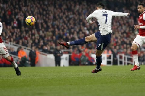Tottenham's Son Heung-min, center, fails to score during the English Premier League soccer match between Arsenal and Tottenham Hotspur at Emirates stadium in London, Saturday, Nov. 18, 2017. (AP Photo/Kirsty Wigglesworth)