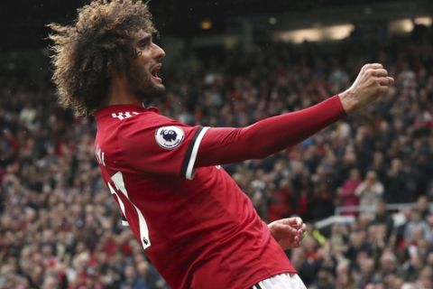 Manchester United's Marouane Fellaini celebrates scoring his side's second goal of the game during the English Premier League soccer match between Manchester United and Crystal Palace at Old Trafford, Manchester, England. Saturday, Sept. 30, 2017. (Martin Rickett/PA via AP)