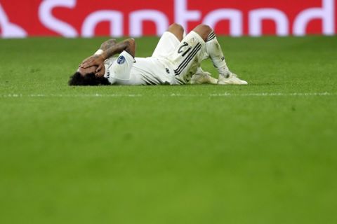 Real defender Marcelo lies on the pitch during a Group G Champions League soccer match between Real Madrid and Viktoria Plzen at the Santiago Bernabeu stadium in Madrid, Spain, Tuesday Oct. 23, 2018. (AP Photo/Manu Fernandez)