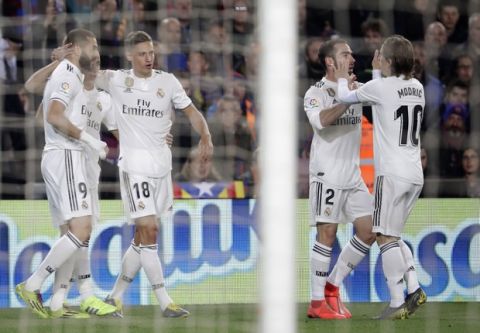 Real players celebrate scoring their side's first goal during the Copa del Rey semifinal first leg soccer match between FC Barcelona and Real Madrid at the Camp Nou stadium in Barcelona, Spain, Wednesday Feb. 6, 2019. (AP Photo/Emilio Morenatti)