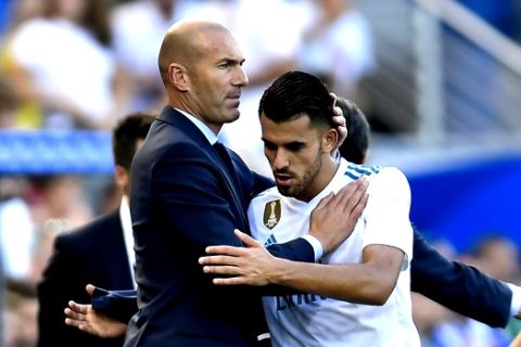 Real Madrid's Dani Ceballos, is congratulated by his head coach Zinedine Zidane as he leaves the pitch during the Spanish La Liga soccer match between Real Madrid and Alaves, at Mendizorra stadium, in Vitoria, northern Spain, Saturday, Sept.23, 2017. Real Madrid won the match 2-1. (AP Photo/Alvaro Barrientos)