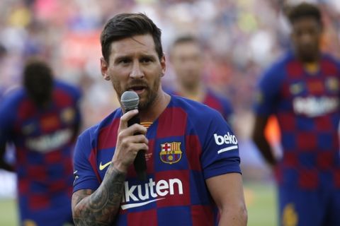 Barcelona forward Lionel Messi addresses the crowd prior of the Joan Gamper trophy soccer match between FC Barcelona and Arsenal at the Camp Nou stadium in Barcelona, Spain, Sunday, Aug. 4, 2019. (AP Photo/Joan Monfort)