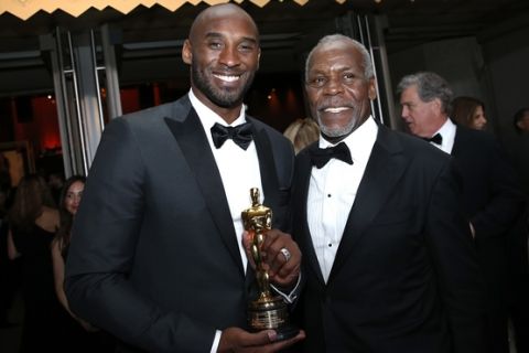 Kobe Bryant, winner of the award for best animated short for "Dear Basketball", left, and Danny Glover attend the Governors Ball after the Oscars on Sunday, March 4, 2018, at the Dolby Theatre in Los Angeles. (Photo by Eric Jamison/Invision/AP)